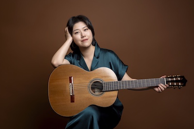 guitarist Bokyung Bo poses with guitar
